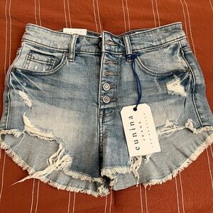 Denim ripped shorts with buttons